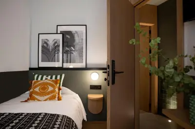 Cama o camas de una habitación en Doña Lola Alojamientos Boutique