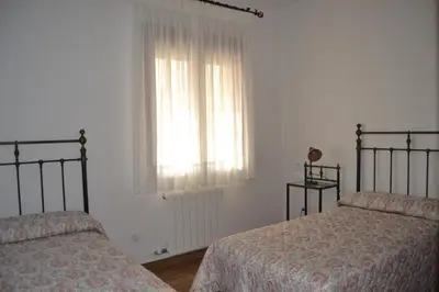 Cama o camas de una habitación en Alojamiento Rural Dehesa La Estancia