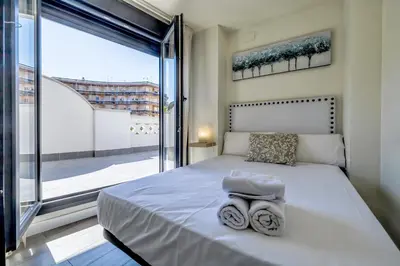 Cama o camas de una habitación en Córdoba Terrace Apartment