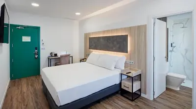 Cama o camas de una habitación en Sercotel Córdoba Delicias