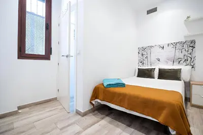 Cama o camas de una habitación en El Limonar de la Ribera Parking Art