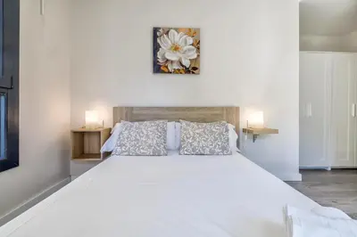 Cama o camas de una habitación en Apartamentos Dama de noche