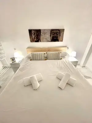 Cama o camas de una habitación en Bj. A Apartamentos Arguiñan