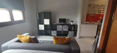 Una televisión o centro de entretenimiento en Apartamento Fibes y Congresos
