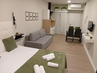 Una televisión o centro de entretenimiento en Ribera Home