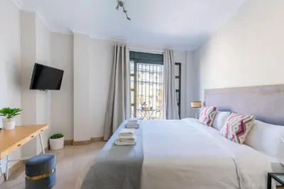 Cama o camas de una habitación en Amador Apartamento Familiar Centro PARKING Amador de los Rios
