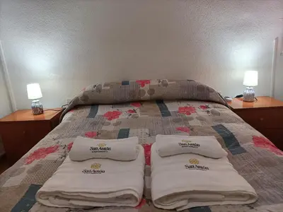 Cama o camas de una habitación en Apartamentos San Antón 2