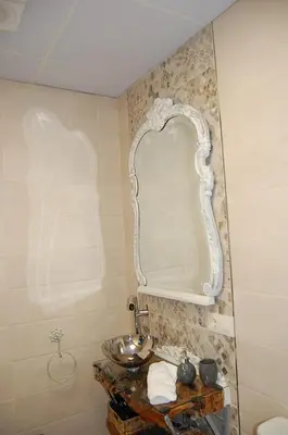 Un baño de Apartamentos Los Jardines& Parking