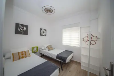 Cama o camas de una habitación en Luminoso piso junto al Mercado de Feria