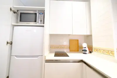 Una cocina o zona de cocina en Patio Rialto Apartment