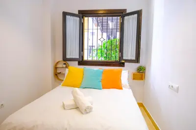 Cama o camas de una habitación en Patio Rialto Apartment