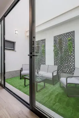 Zona de estar de Family suit principal encantos de Sevilla