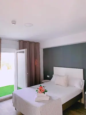 Cama o camas de una habitación en Hostal El Castillo Alcala De Guadaira