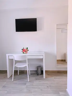 Una televisión o centro de entretenimiento en Hostal El Castillo Alcala De Guadaira
