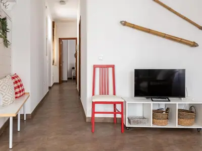 Una televisión o centro de entretenimiento en Apartamento Las Tazas (Parking Gratuito)