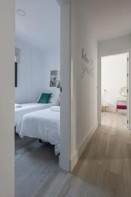 Cama o camas de una habitación en Family HOME SUITS Encantos de Sevilla
