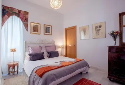 Cama o camas de una habitación en Vidrio Sevilla Deluxe Apartment