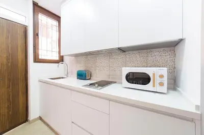 Una cocina o zona de cocina en Precioso Loft El Arcángel II junto a la Ribera