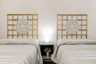 Cama o camas de una habitación en AvantiStays La Judería, vive Sevilla con los cinco sentidos