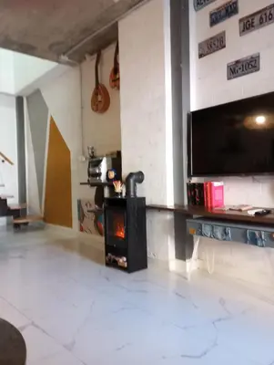 Una televisión o centro de entretenimiento en Casa suig
