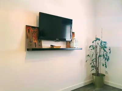 Una televisión o centro de entretenimiento en Recien renovado junto a Santa Justa y el centro