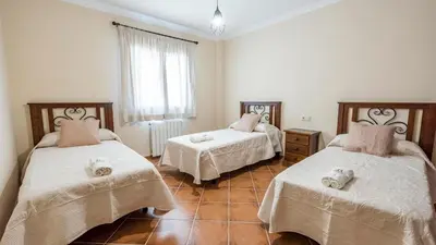 Cama o camas de una habitación en Finca Cerro Alcolea Periana by Ruralidays