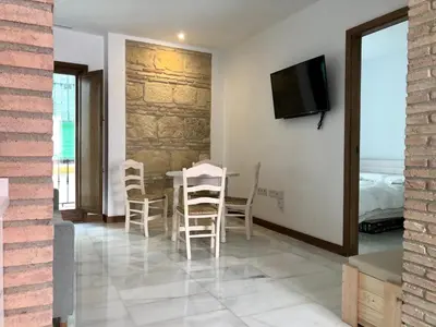 Una televisión o centro de entretenimiento en La Casa de La Escalera