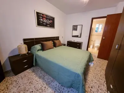 Cama o camas de una habitación en Vivienda Turística en Típico Patio Cordobés San Basilio
