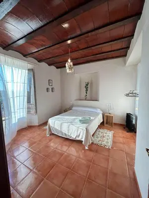 Cama o camas de una habitación en Cortijo La Torquilla Laguna Fuente de Piedra