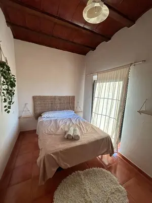 Cama o camas de una habitación en Cortijo La Torquilla Laguna Fuente de Piedra