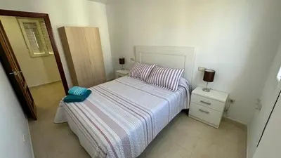 Cama o camas de una habitación en APARTAMENTO el CARMEN
