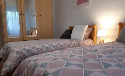 Cama o camas de una habitación en APARTAMENTO SAN LORENZO
