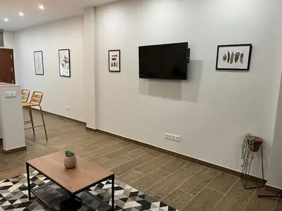 Una televisión o centro de entretenimiento en Acogedor apartamento en la Buhaira