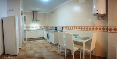 Una cocina o zona de cocina en Modern Apartment in Peñaflor with Air Conditioning - 85 m²