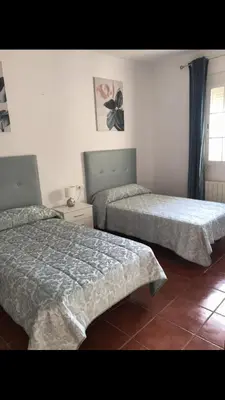 Cama o camas de una habitación en Casa Rural Moreno