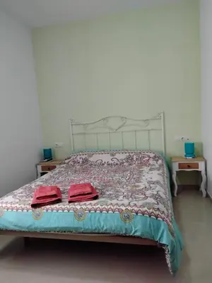 Cama o camas de una habitación en Alojamiento en Bujalance