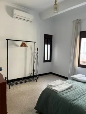 Cama o camas de una habitación en Bonito apartamento céntrico cerca de Sevilla