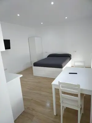 Cama o camas de una habitación en CASTRO Suites Osuna