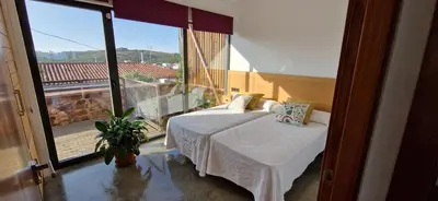 Cama o camas de una habitación en Casa Cuartel Centenillo - Alojamientos Rurales en Sierra Morena