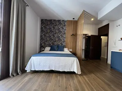 Cama o camas de una habitación en APARTAMENTOS TURISTICOS SINAG