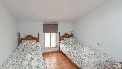 Cama o camas de una habitación en Casa Los Baenas Casabermeja by Ruralidays