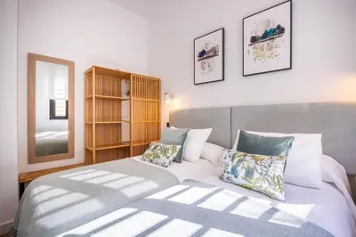 Cama o camas de una habitación en BeHouse Macarena