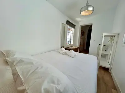 Cama o camas de una habitación en Ático con vistas espectaculares a la Catedral - CozyHomeSevilla7