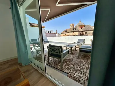 Un balcón o terraza de Ático con vistas espectaculares a la Catedral - CozyHomeSevilla7