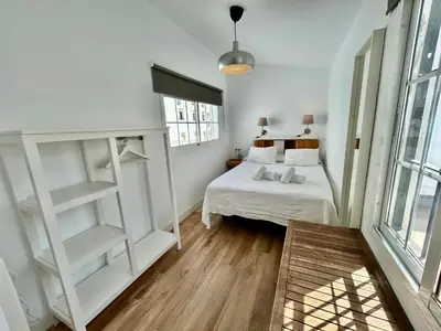Cama o camas de una habitación en Ático con vistas espectaculares a la Catedral - CozyHomeSevilla7