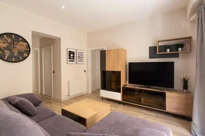 Una televisión o centro de entretenimiento en Vivienda con Fines turísticos 