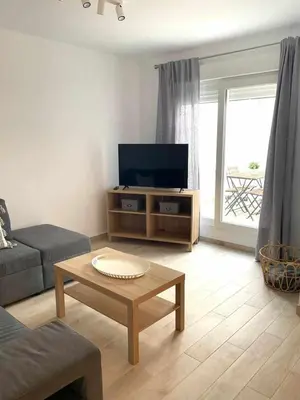 Una televisión o centro de entretenimiento en Apartamentos Azonaicas Centro Tendillas