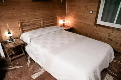 Cama o camas de una habitación en La Cabaña