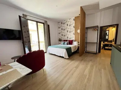 Cama o camas de una habitación en Cosy apartment in Córdoba, city view, 32 sqm, balcony