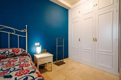 Cama o camas de una habitación en APARTAMENTO EN CASA PALACIO CON PISCINA 15 MAYO a 15 OCTUBRE